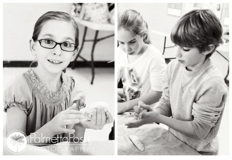 girl holding clay, boy rolling clay