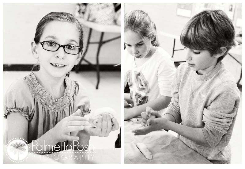 girl holding clay, boy rolling clay